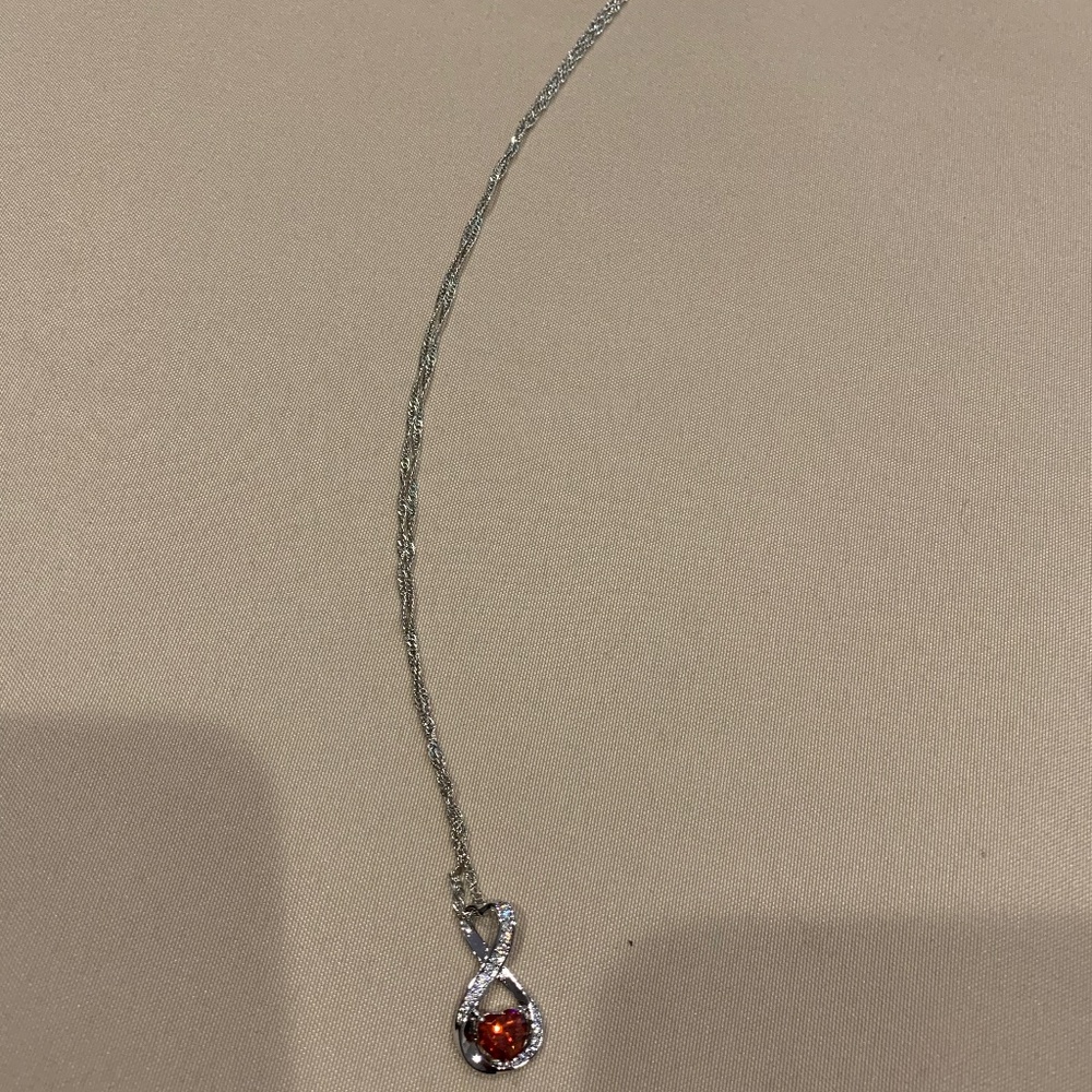 Silvertone Necklace w/ Infinity-Shaped Pendant w/ a Red Heart-Shaped Rhinestone